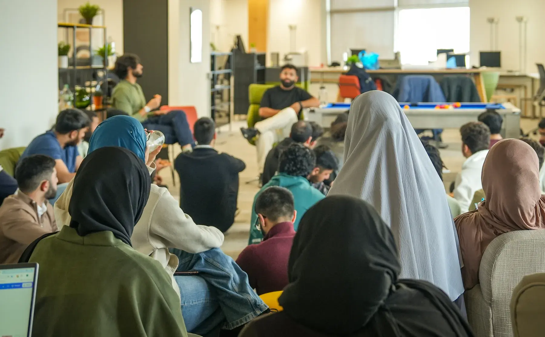 Students listening to speakers at an informal IHSAAN session