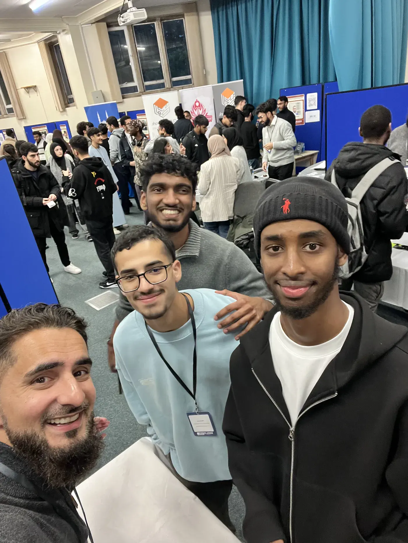 Students taking a group selfie at a careers fair