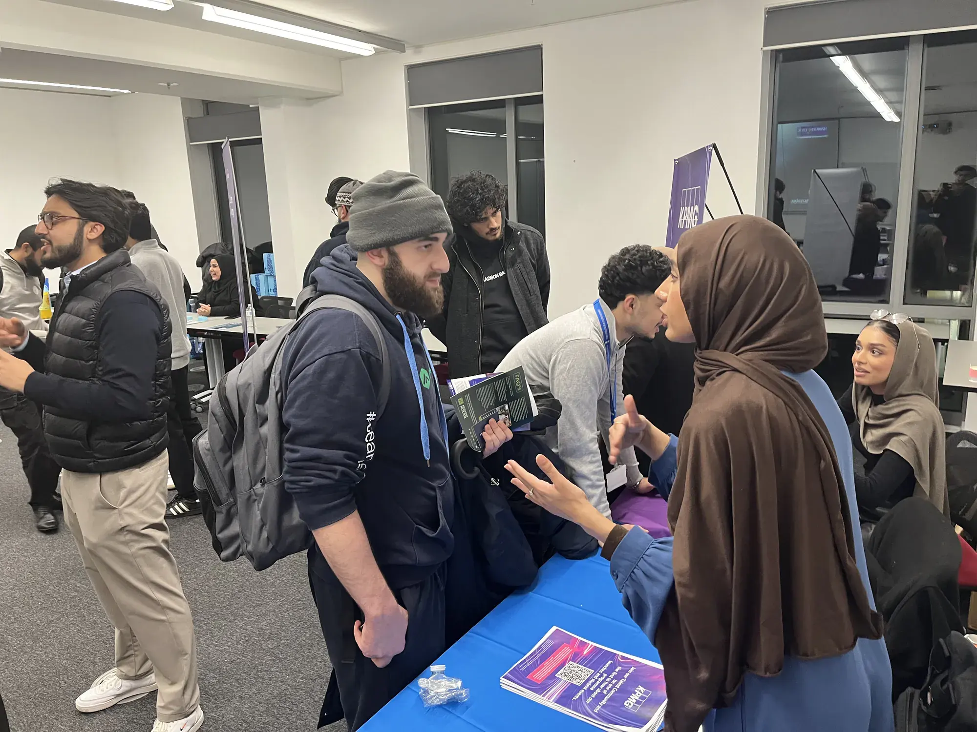 Students in conversation at employer tables