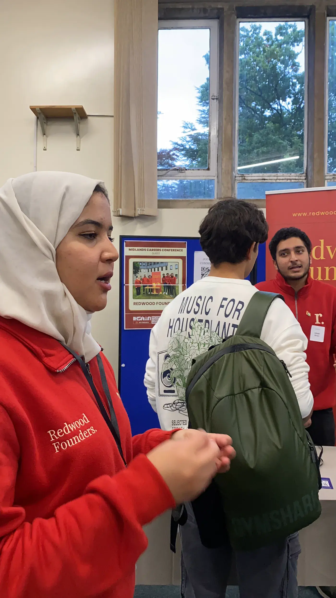 A student speaking with an employer at a careers fair