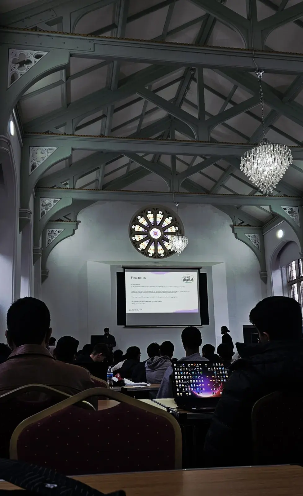 The heritage hall during a hackathon presentation