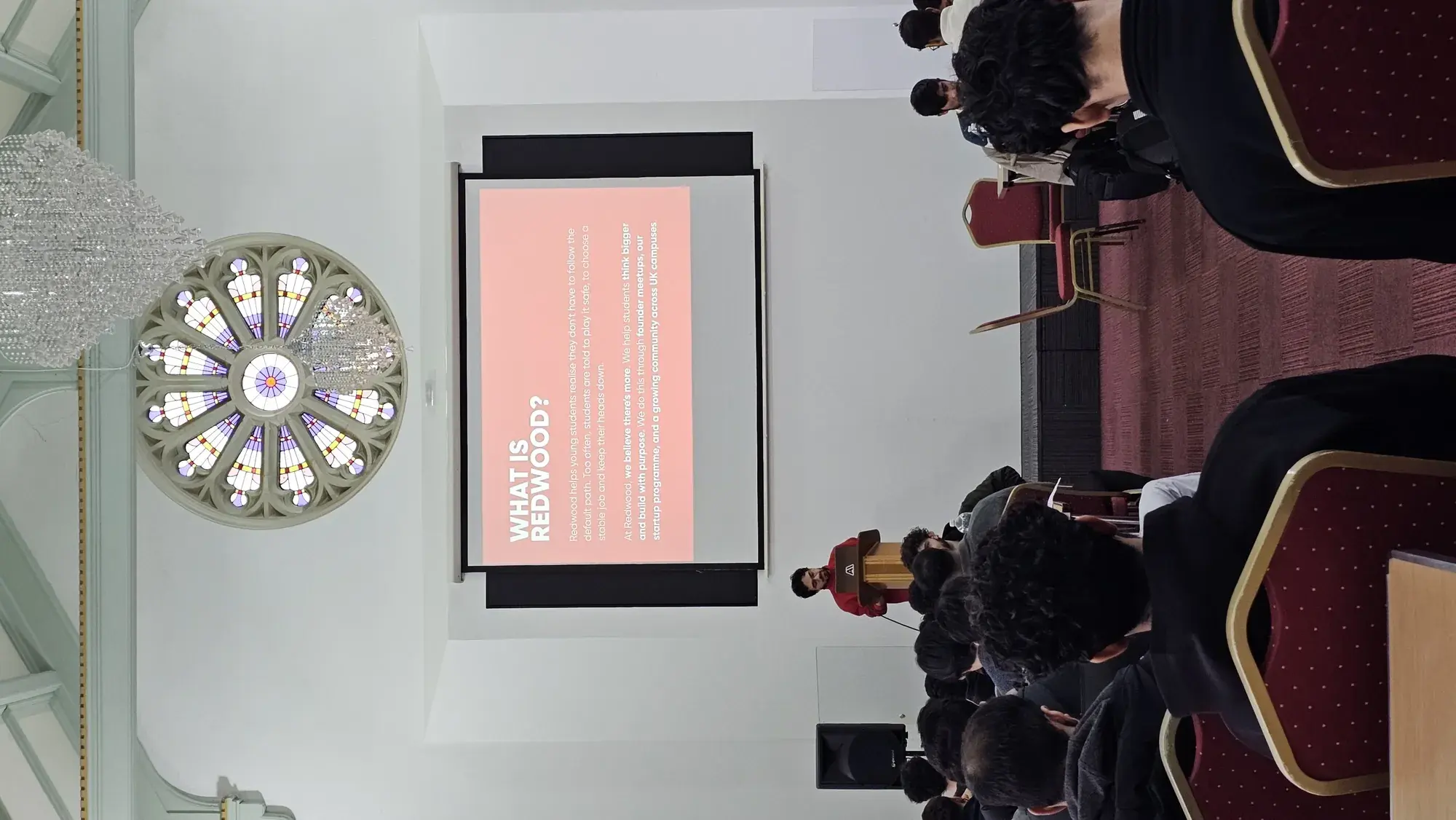 Audience watching a partner talk in the heritage hall